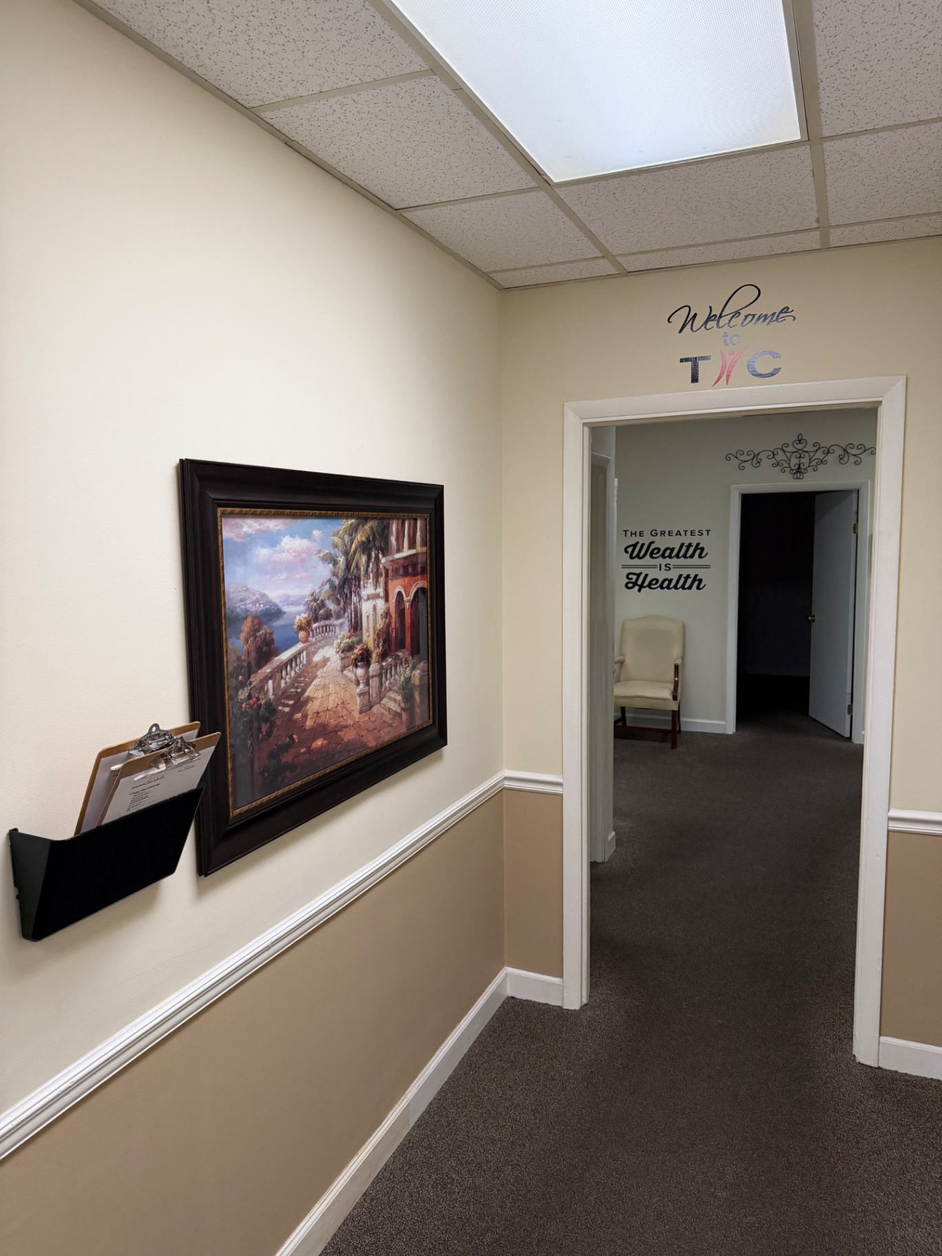 Hallway with landscape artwork at Total Health Chiropractic