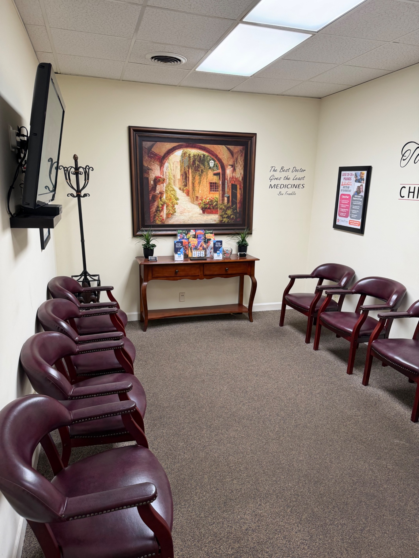 Waiting area with chairs and landscape artwork at Total Health Chiropractic